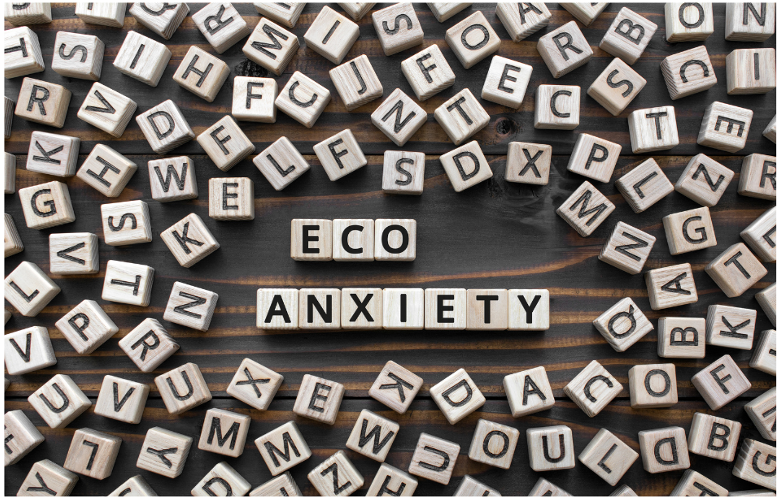 scrabble tiles spelling out eco anxiety  