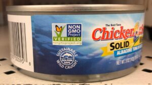 Can of tuna with a protecting dolphins sticker on it even though this company has been called out for not protecting dolphins properly while fishing